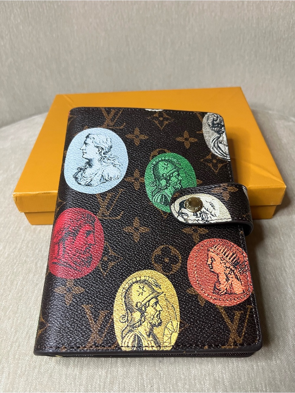 Brown Monogram Agenda Cover with Multicolor Coin Motifs